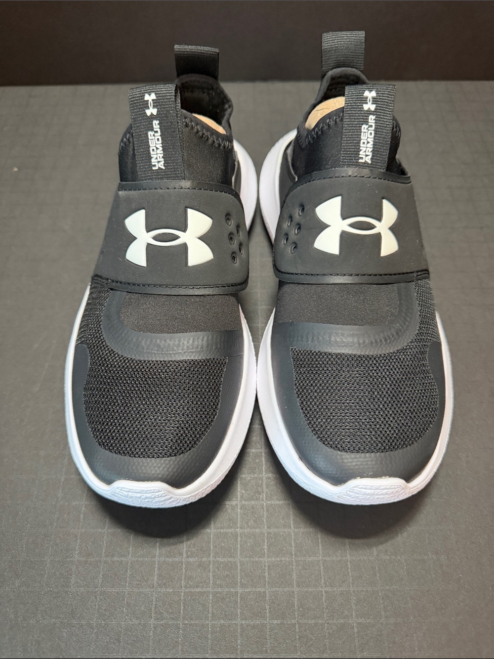 Under Armour Black and White Slip-On Sneakers